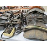 Contents to part table top - saddles, brass buckles, headbands, harnesses, shaft horse saddles etc.