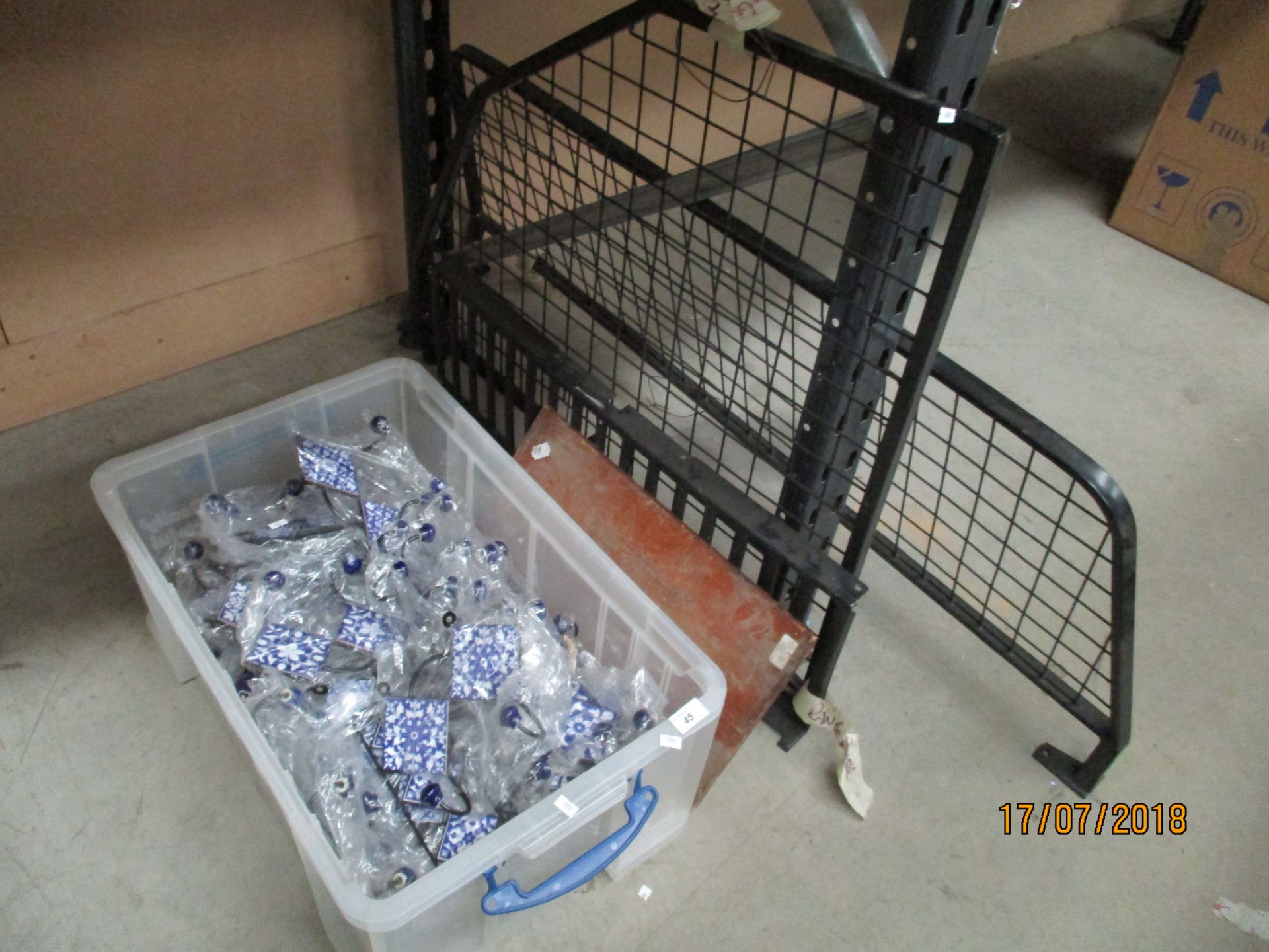 Contents to under rack - large quantity of blue and white decorative tiled clothing hooks,