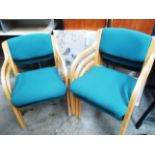 Five green upholstered reception chairs on light wood frame
