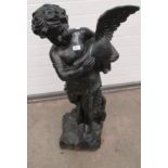 Metal black painted statue of a child holding a bird approx.