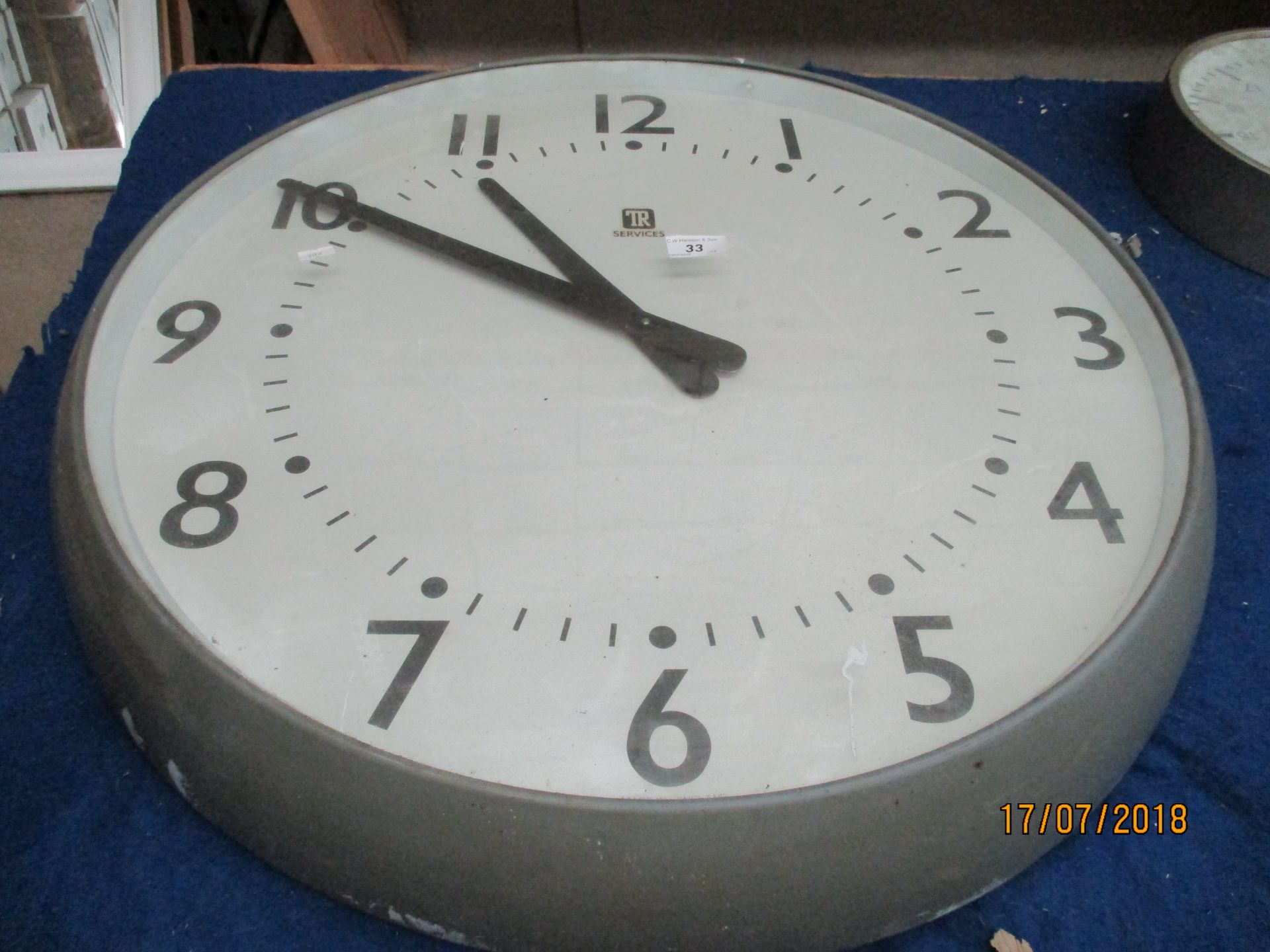 A TR Services electric wall clock 28cm diameter