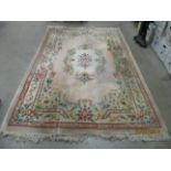 A brown patterned Chinese rug 177 x 270cm