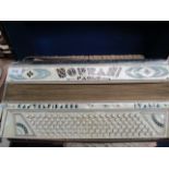 Castelfidardo Italia Paolo Naprani accordion in a portable case and a quantity of sheet music