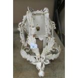 A French style distressed metal wall light with arm bracket
