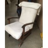 A wood framed rocking chair