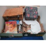 Contents to two boxes - Vogue magazines, picnic basket, quantity of linen, sewing box with contents,