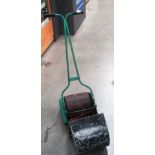 A Webb children's metal push along lawnmower complete with collection box