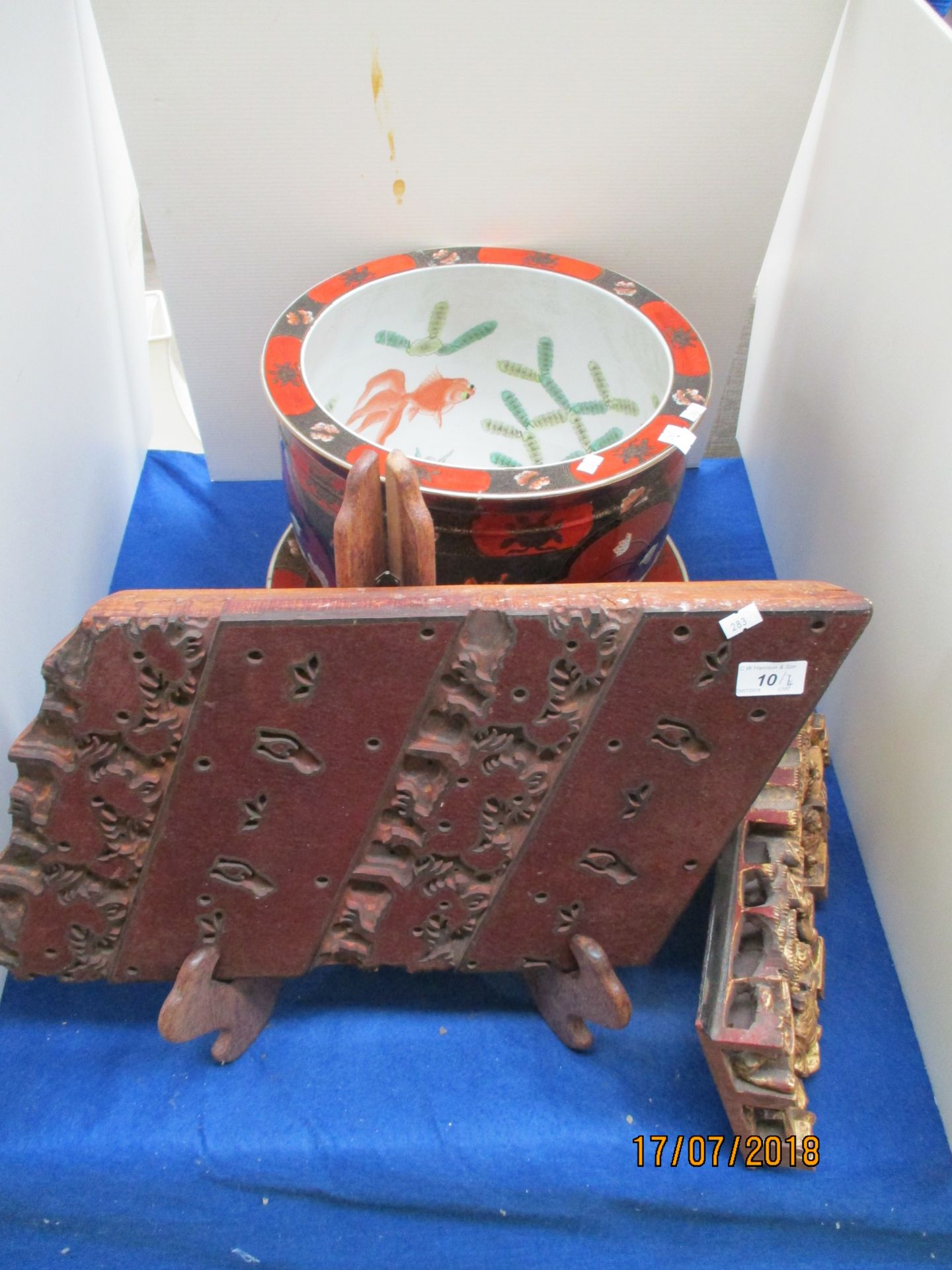 Four items - Oriental carved wall plaque, Oriental printing block on stand,
