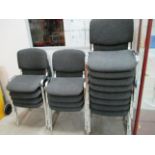 Sixteen charcoal upholstered stacking chairs on chrome feet