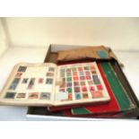 Four small stamp albums and contents,