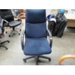 A blue velour upholstered office high back armchair