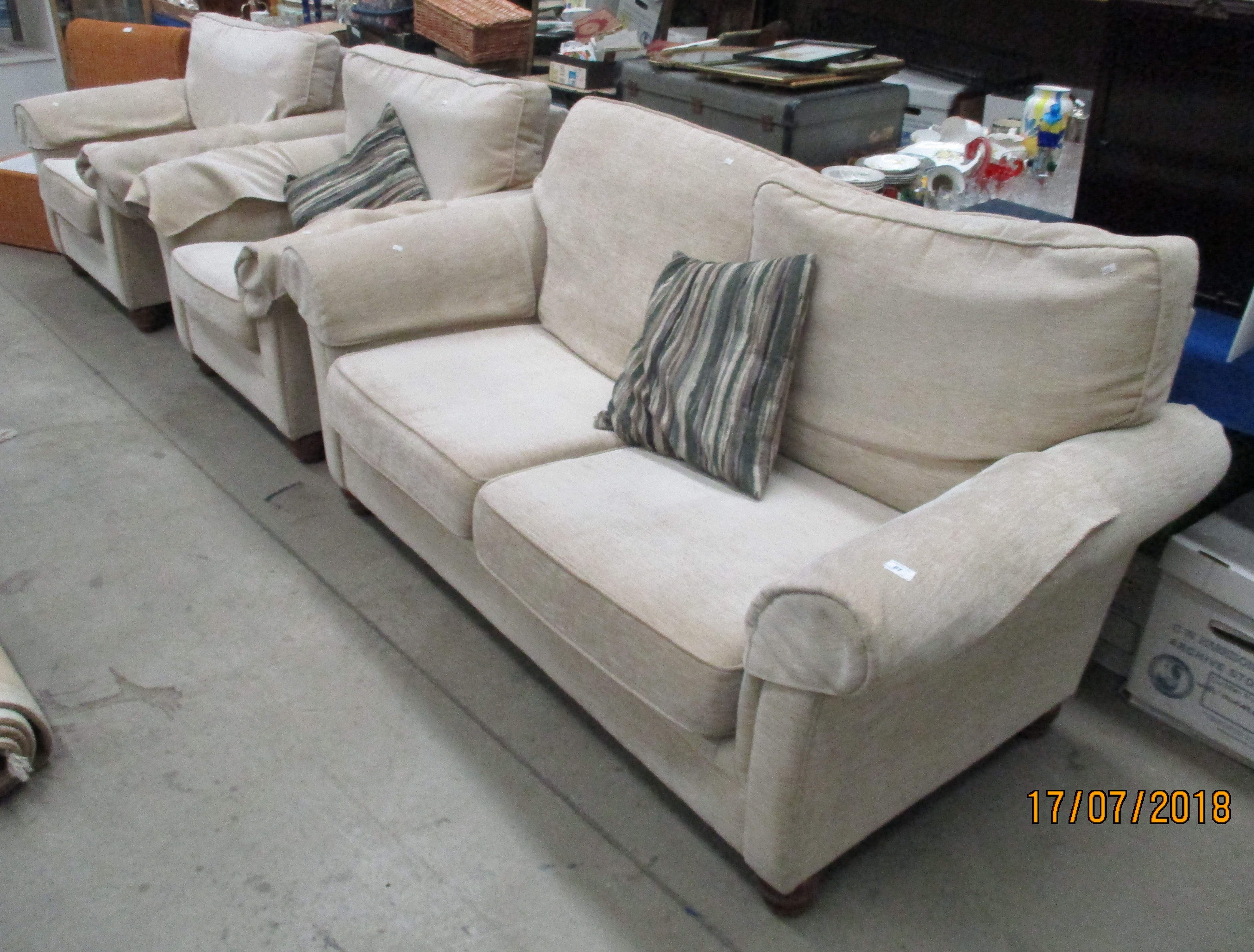 A Marks and Spencer's light beige three piece suite comprising three seater settee and two