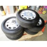 Five alloy wheels and tyres for a Mercedes S280 class vehicle complete with a box of studs