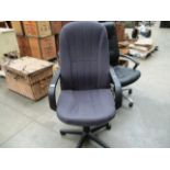 A purple patterned high back office arm chair