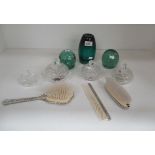 Three green glass dumps with damages and a glass and metal part dressing table set
