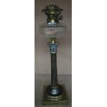 A brass Corinthian column oil lamp