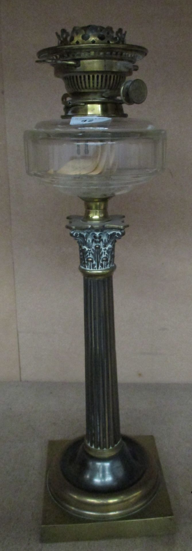 A brass Corinthian column oil lamp