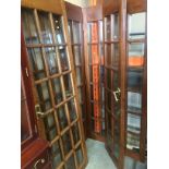 Two pairs of glazed solid oak doors with brass door fittings - one pair is bi-fold 193 x 90cm when