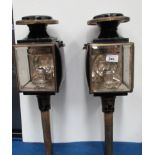 Pair of black metal and brass coach lamps inscribed 'Robertson,