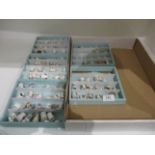 Contents to five miniature shelves - a collection of miniature thimbles