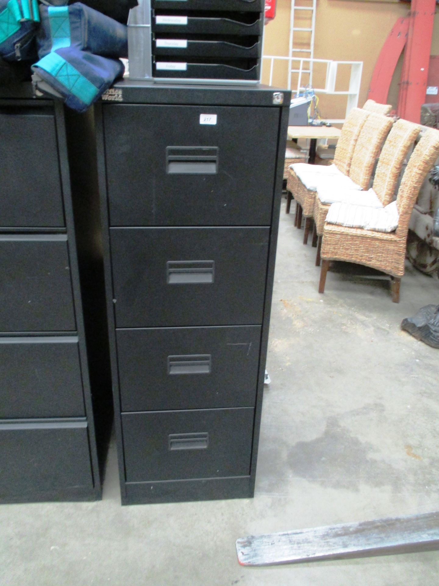 A black metal four drawer filing cabinet (unlocked no key)