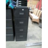 A black metal four drawer filing cabinet (unlocked no key)