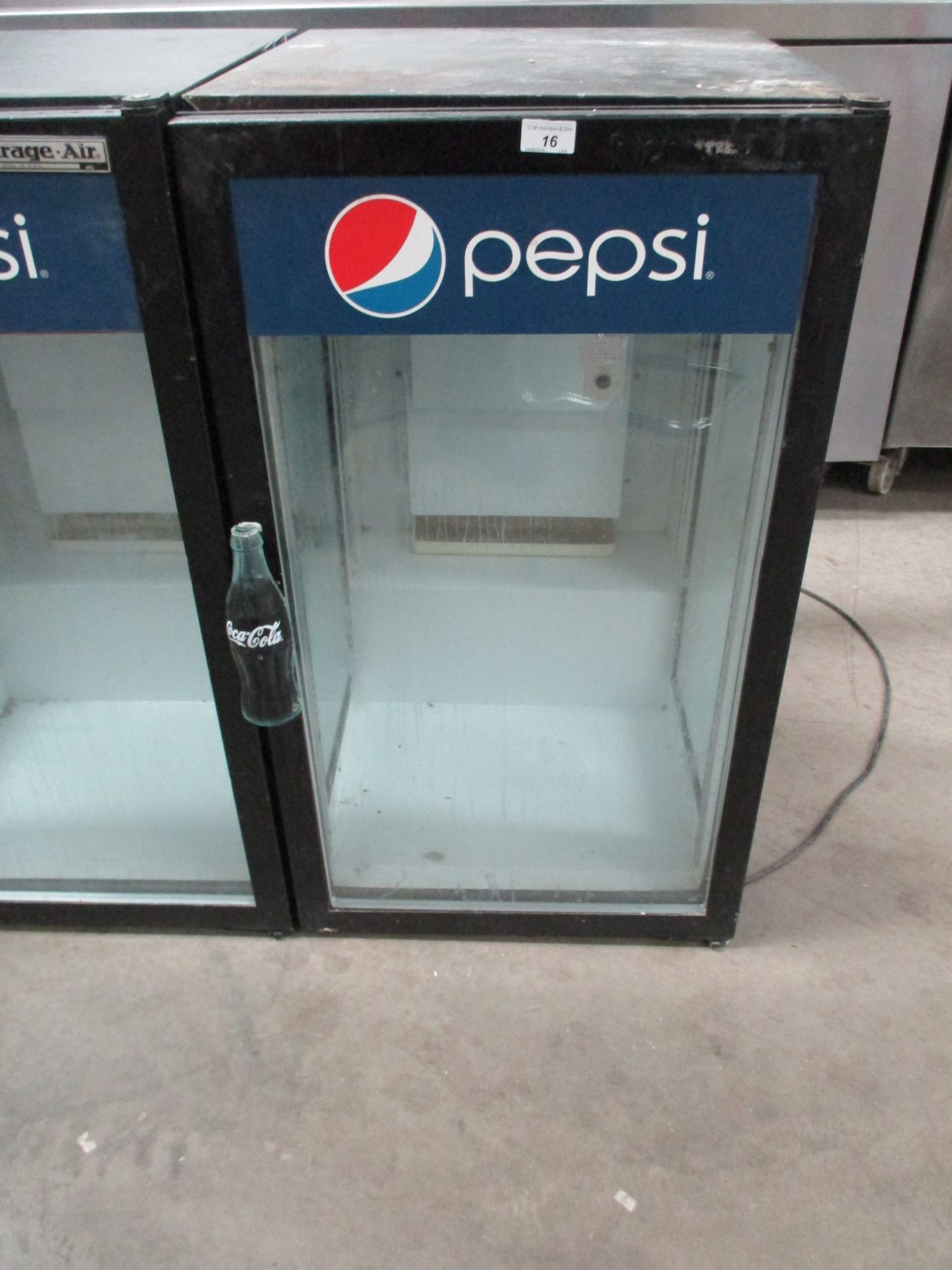 A Beverage Air single door glass front Pepsi bottle chiller