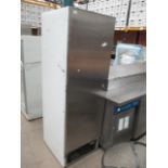 A stainless steel single door commercial freezer