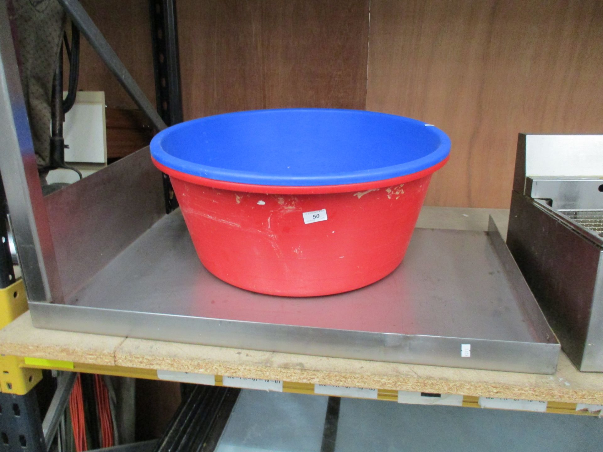 A stainless steel side table and two large buckets