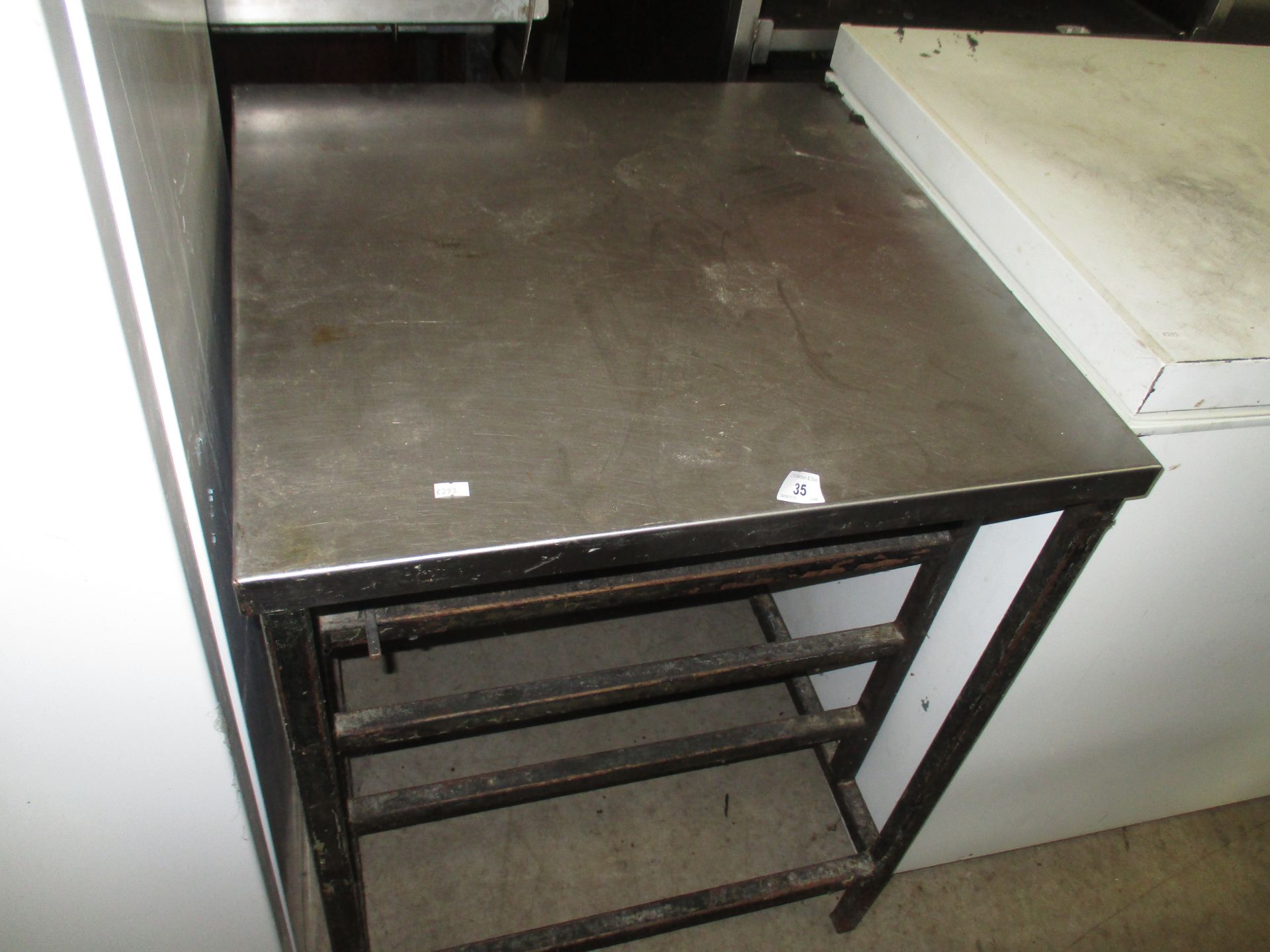 A stainless steel preparation table 60 x 60cm