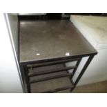 A stainless steel preparation table 60 x 60cm