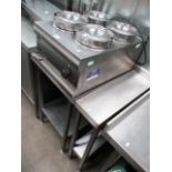A Hobart stainless steel four pan bain marie complete with a stainless steel table and a side table