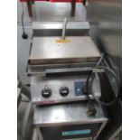 A Rowlett Rutland stainless steel food press