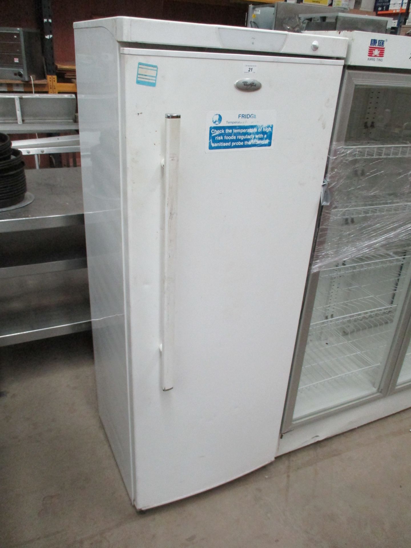 A Whirlpool white upright fridge (earth fault when electrically tested)