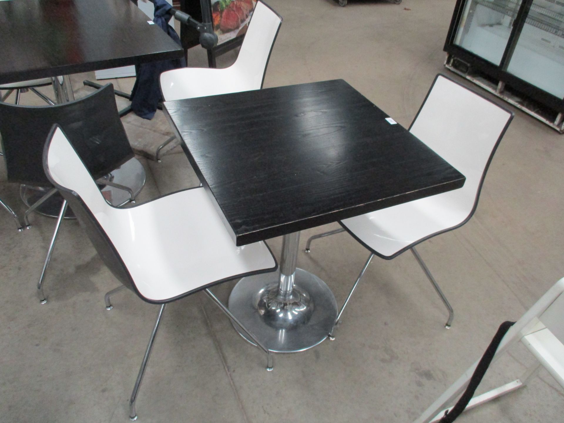 A solid black wood square cafe table 65 x 65cm on chrome metal single column base complete with 2 x
