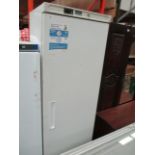 A white upright freezer