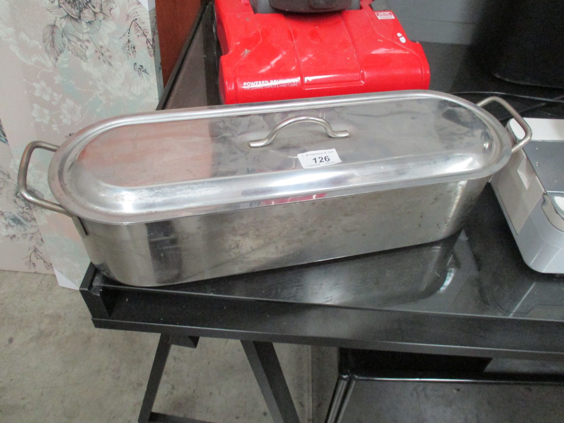 A stainless steel food warmer