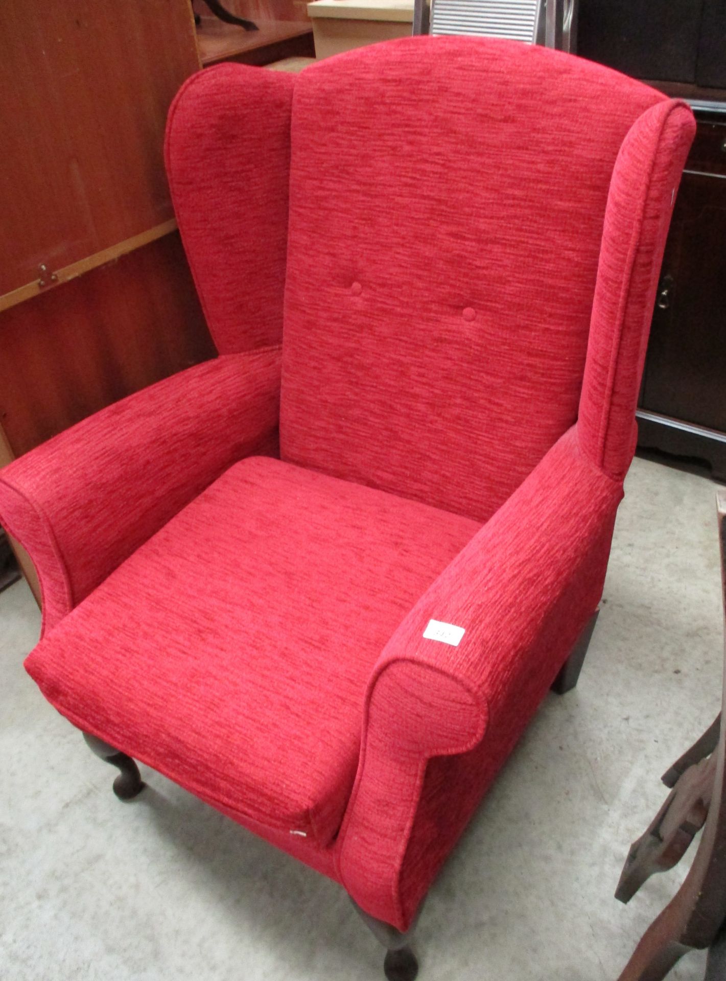 A red moquette upholstered armchair