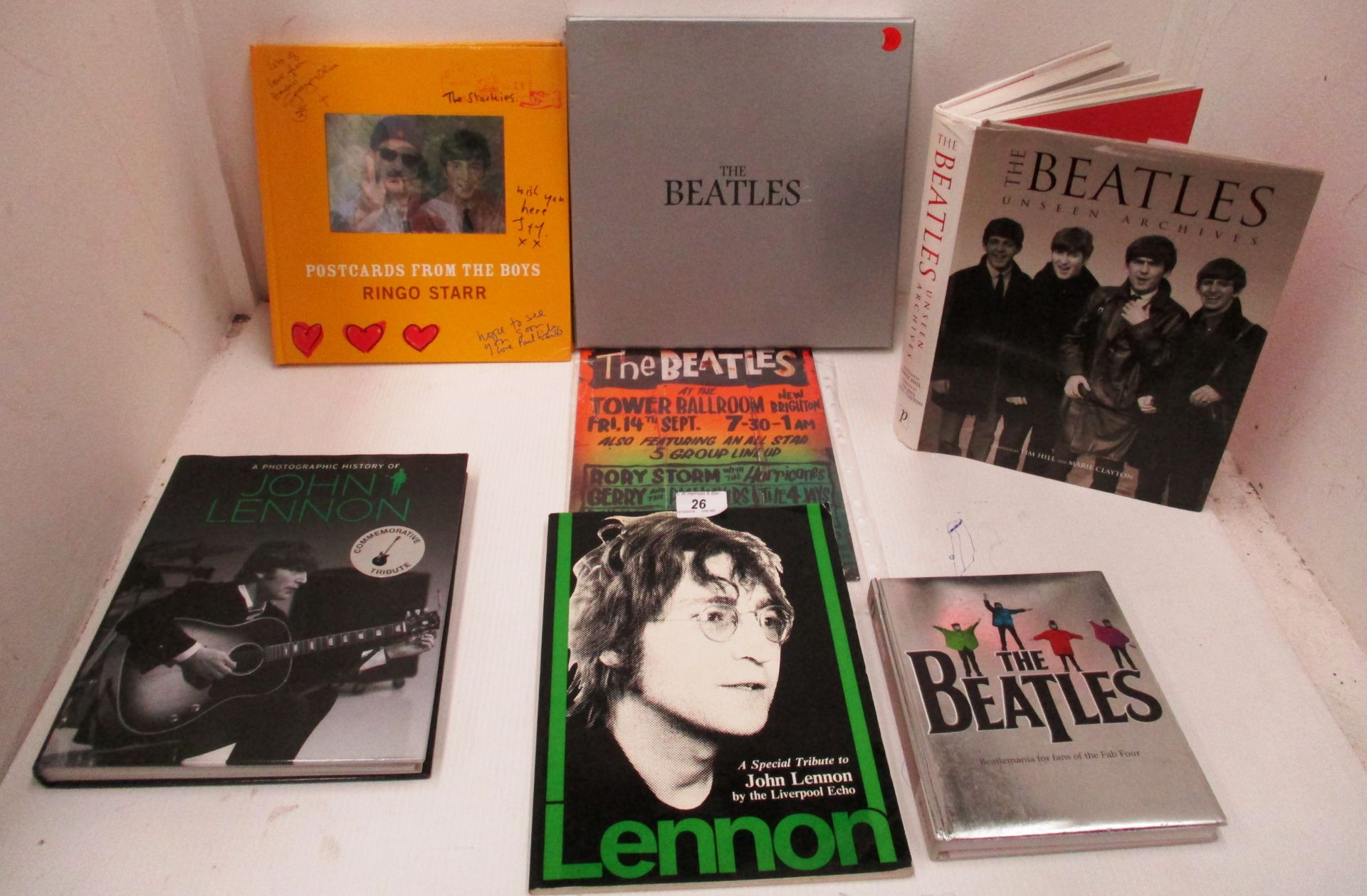 Collection of Beatles books and metal plate plaque