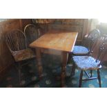 Pine dining table 105cm x 65cm x 77cm with four spindle back dining chairs and four loose cushions