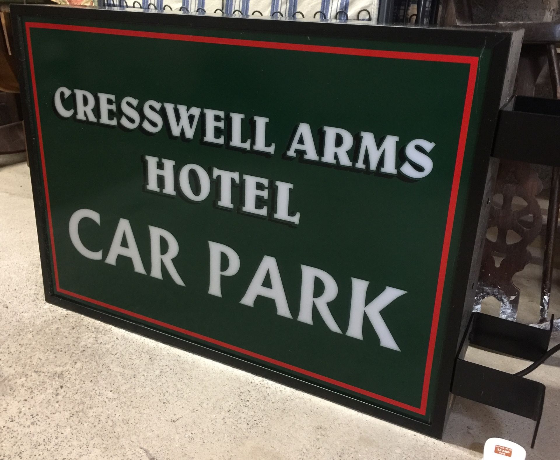 A metal framed wall mounting double sided illuminated perspex car park sign,