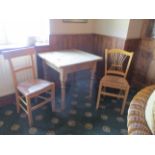 Three items - pine table 75cm x 75cm x 75cm high with two non-matching wicker seat chairs