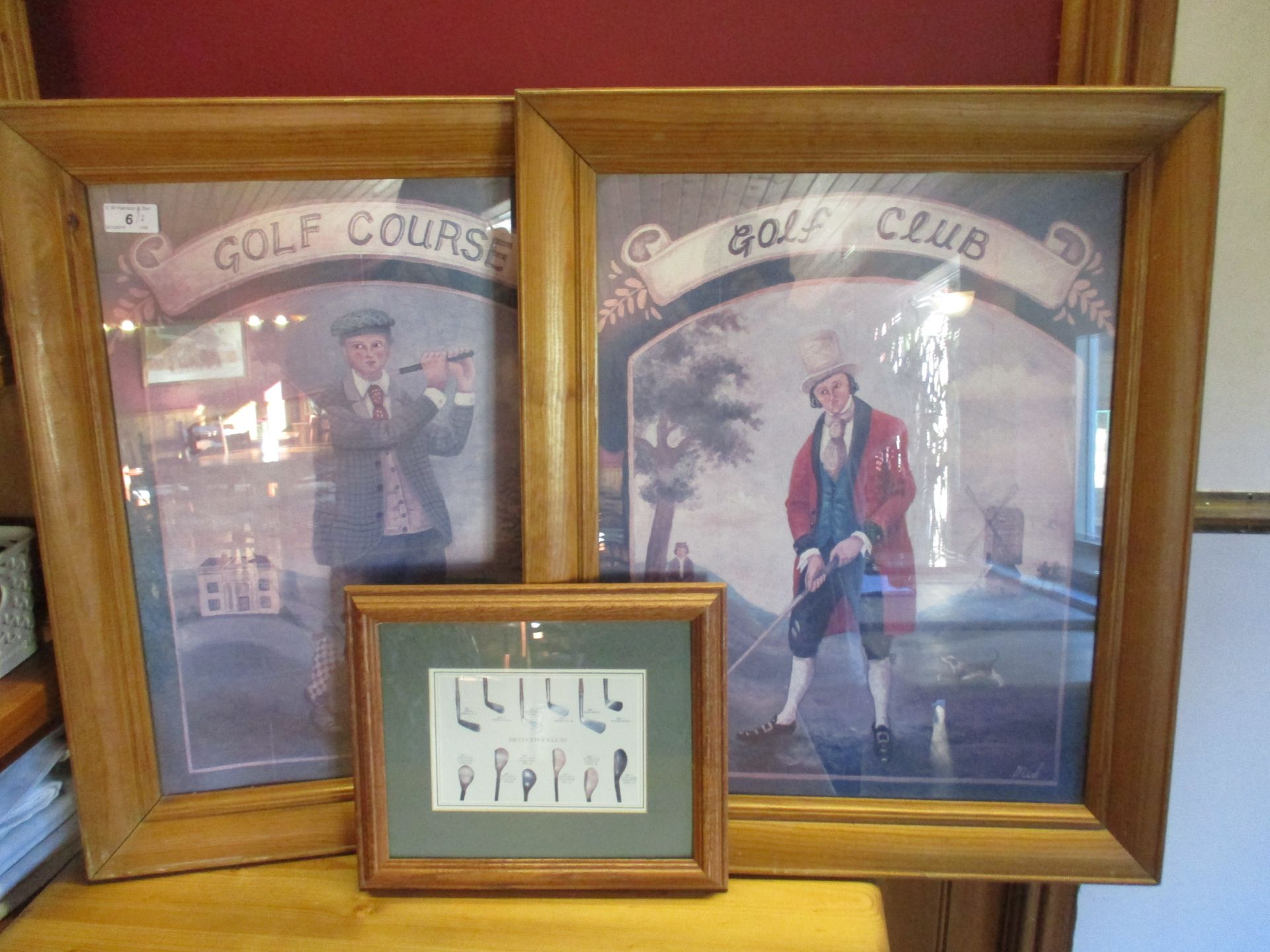 Two framed golf prints on board,