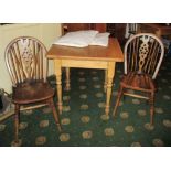 Pine dining table 75cm x 75cm x 77cm with 2 x spindle back oak chairs and two cushions