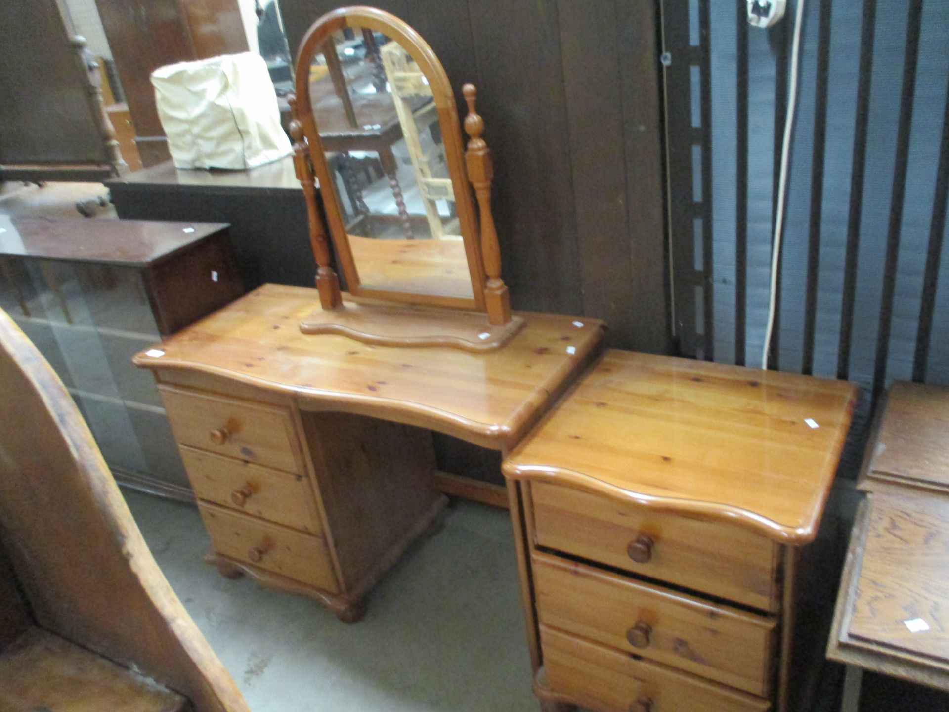 A pine three drawer single pedestal dressing table,