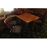 Pine dining table 120cm x 75cm x 76cm with four wooden dining chairs (upholstery to seats damaged)