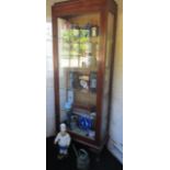 Glass fronted mahogany display cabinet in porch with four glass shelves,