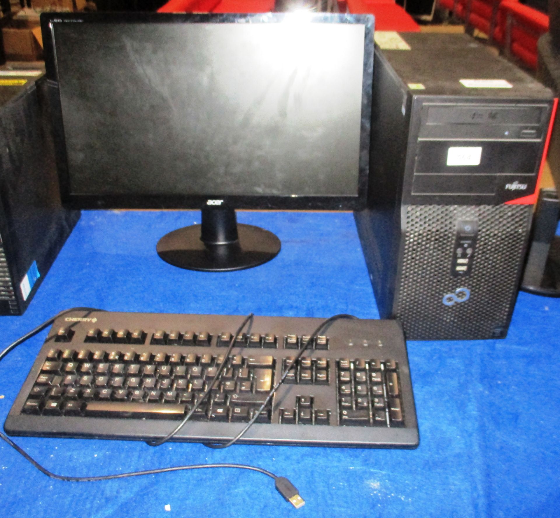 A Fujitsu tower computer - power lead complete with a Acer 22" LCD monitor - power lead,