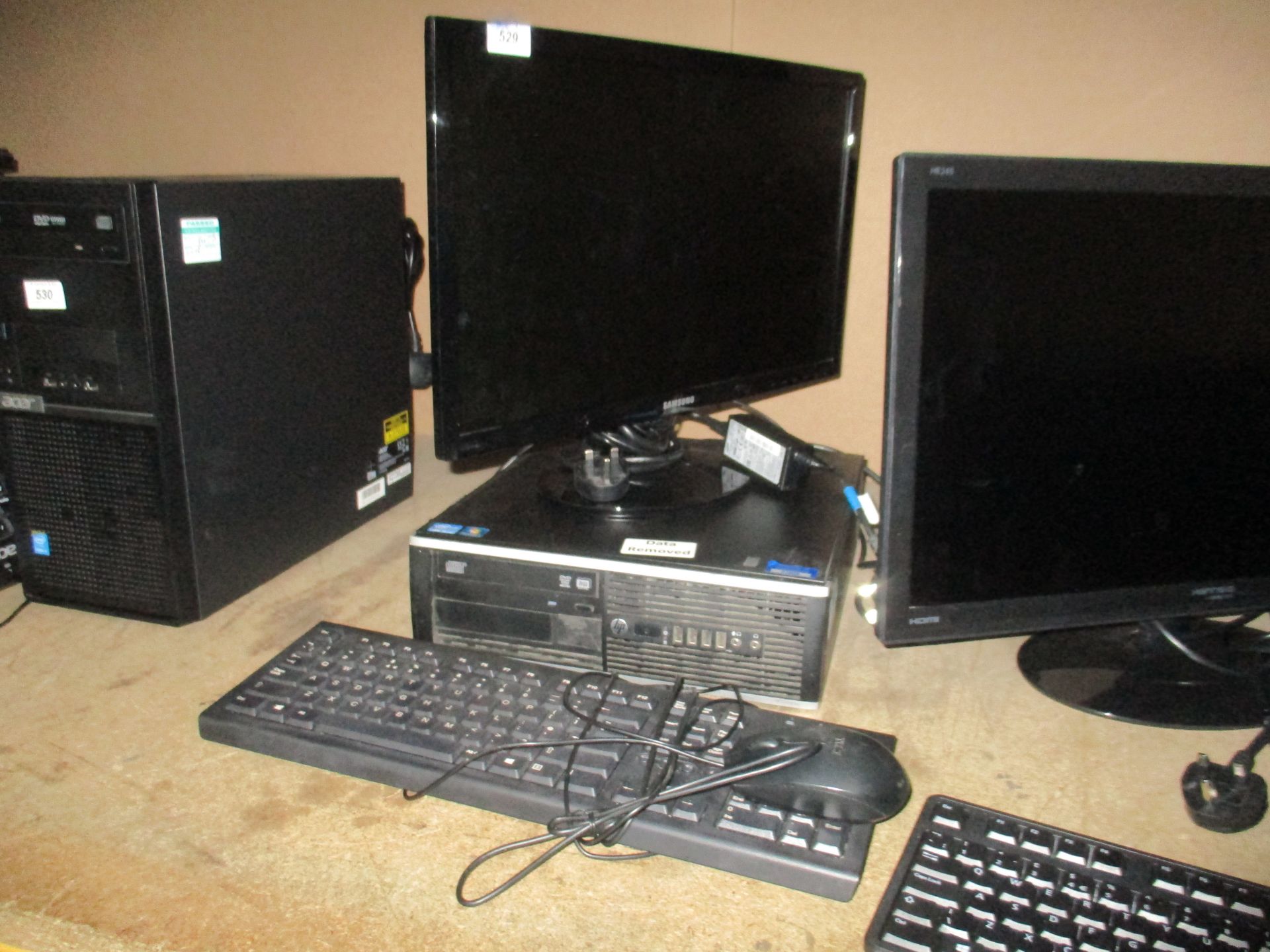 A HP desktop computer - power lead, complete with a Samsung 22" LCD monitor,