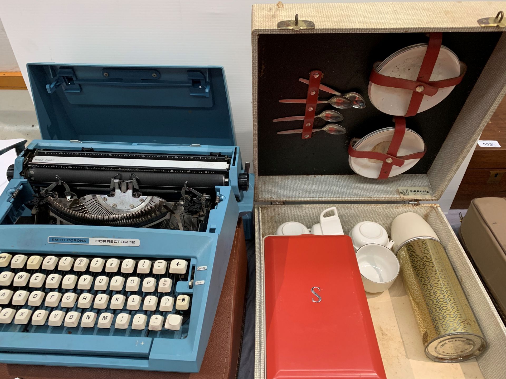 A Smith Corona Corrector 12 manual typewriter and a Sirram picnic set in case